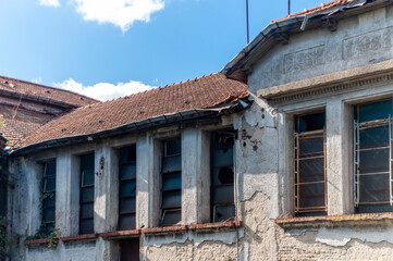 Old building destroyed almost in ruins devastated by time abandoned by its inhabitants