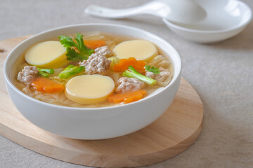 Clear soup with egg tofu and minced pork, Thai food.