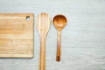 wooden kitchen utensils on wooden table 