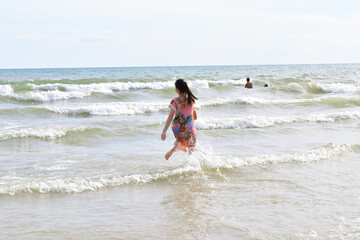 Fototapeta premium Little Girl at The Sea
