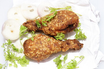 Hot and crispy fried chicken legs isolated on a white background