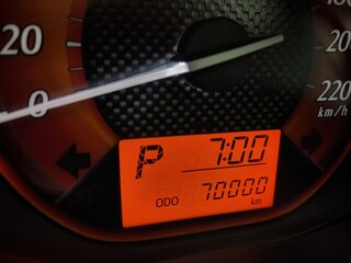 The car odometer display measures 70,000 Kilometers in neutral gear position. 7 O'clock