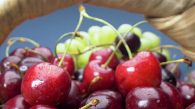 super close up. Details of cherries, green and red grapes in a basket