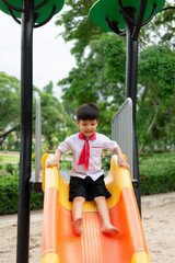 Happy cute little child playing in the park outdoors