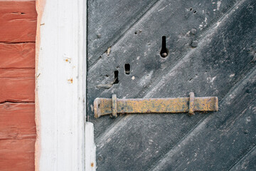 Old wooden door with an old, antique lock, swedish historical building