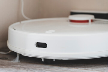 White robot vacuum cleaner. robotic exhauster