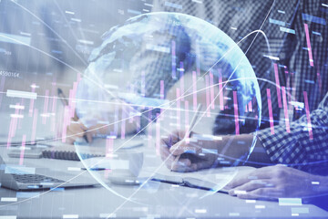 Multi exposure of forex chart with man working on computer on background. Concept of market analysis.