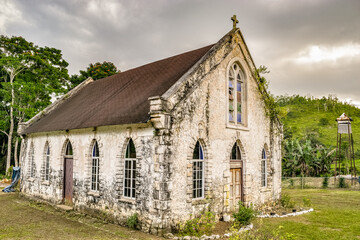 Fototapeta na wymiar Saint Mary, Jamaica. Jamaican church. Vintage/ centuries old Saint Andrew's Anglican Church in Labyrinth