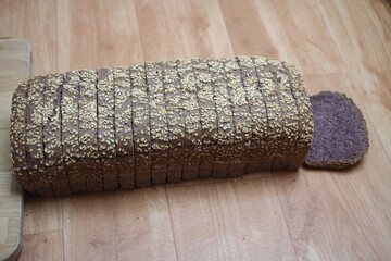 healthy bread made with black rice on a wooden background
