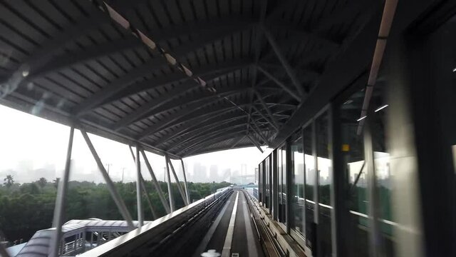 Tokyo, Japan,Jun 26, 2020 HD Hyperlapse footage of train view moving forward pass Rainbow bridge, Odaiba in Tokyo, or well-known as Yurikamome line  Japan tourism, advance transport technology concept