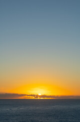 Naklejka na ściany i meble Morning sun rise and reflection on the ocean