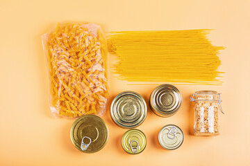 Donation bag with various food on orange background with copy space. Flat lay. top view, Mockup....