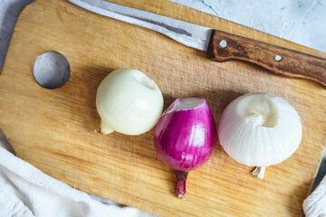 Cutting onions. Preparing salad, meal or dinner. Organic food