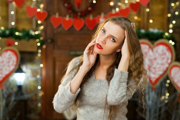 attractive woman in love in grey warm sweater celebrate valentine's day and waiting for man