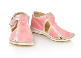 Children´s pink slippers isolated on the white background. With clipping path. Kid´s pink slippers. With vector path. Comfortable slippers isolated on the white background with shadow reflection.
