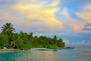 Fototapeta na wymiar Tropical island with sandy beach, palm trees