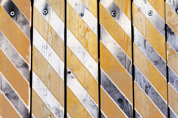 texture of wooden vertical boards with diagonal gray stripes for the background