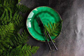 Summer rural table setting with fern