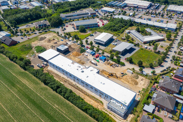 Fototapeta na wymiar drone photograph of a large construction site where a factory building is being erected