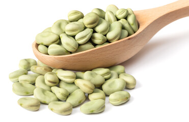 dried green broad beans in the wooden spoon, isolated on white background