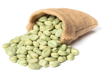 dried green faba beans in the sack, isolated on white background