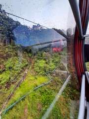 View of cable car to Genting highland with the water dropped on the glass in Kuala Lumpur Malaysia