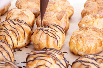 Cooking profiteroles on the table