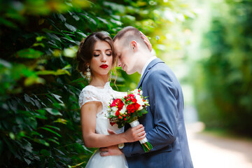 Wedding couple, happy newlyweds and husband hugging in green park.