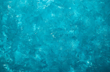 Turquoise background. Putty texture