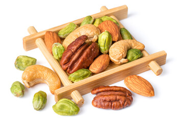 unsalted mixed nuts in the wooden plate, isolated on white background