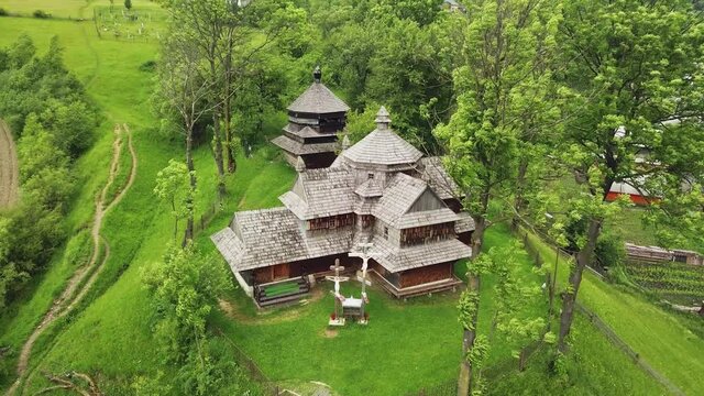 Wooden church in Carpathian, Ukraine. Aerial shot