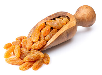 yellow raisins in the wooden scoop, isolated on white background