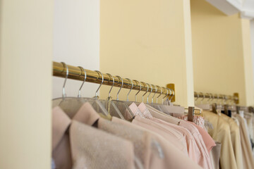 Female things of pink color on a hanger closeup. New collection in the store.