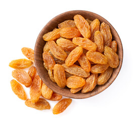 yellow raisins in the wooden bowl, isolated on white background, top view.