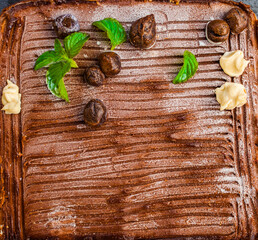 homemade raw healthy cake with  cocoa and hazelnut flat lay on granite close up healthy food concept