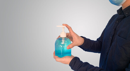 Man using hand sanitizer gel potect covid 19, Side view.