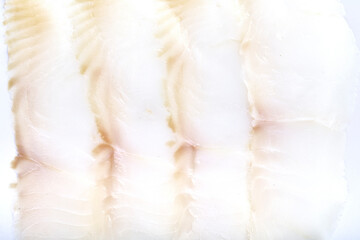 White smoked fish slices macro closeup texture