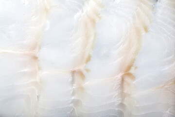 White smoked fish slices macro closeup texture