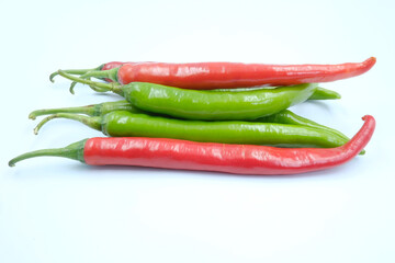 Fresh green and red chili peppers on the white background, organic ingredient for healthy, hot and spicy to help burning fat