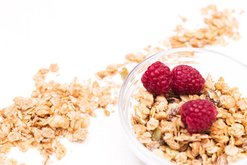 Crispy muesli with raspberry dry Breakfast isolated on white background selective focus, top view