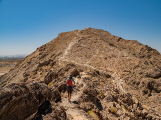 Fototapeta premium Woman hiking in Lone Mountain