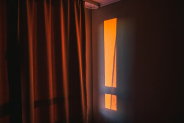 Ufa, Russia march 28, 2020 the morning warm rays of the sun penetrate through the slit of the curtain on the wall