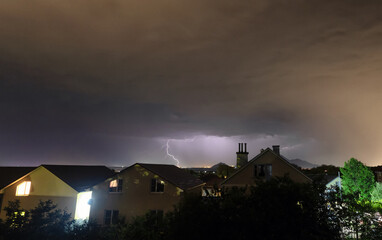 A flash of lightning against the evening sky