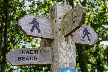 Footpath sign on the Coast path to a beach Pembrokeshire Wales