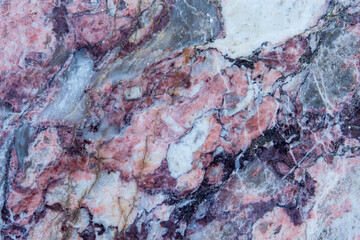 Stone background, multicolored marble slab with various lines and cracks