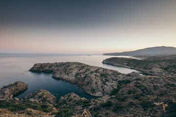 A rocky beach next to a body of water