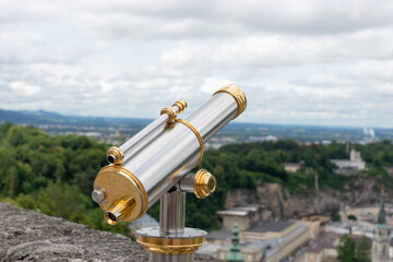 The tourist telescope at lookout where tourists can observe landscape and city
