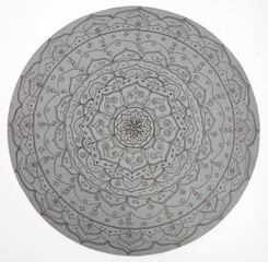 Hand-drawn lotus mandala on gray paper on white background