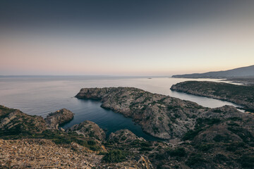 A rocky beach next to a body of water