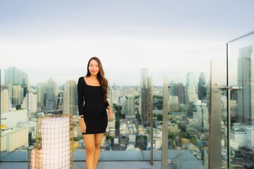 Fototapeta na wymiar Portrait beautiful young asian woman at rooftop bar and restaurant